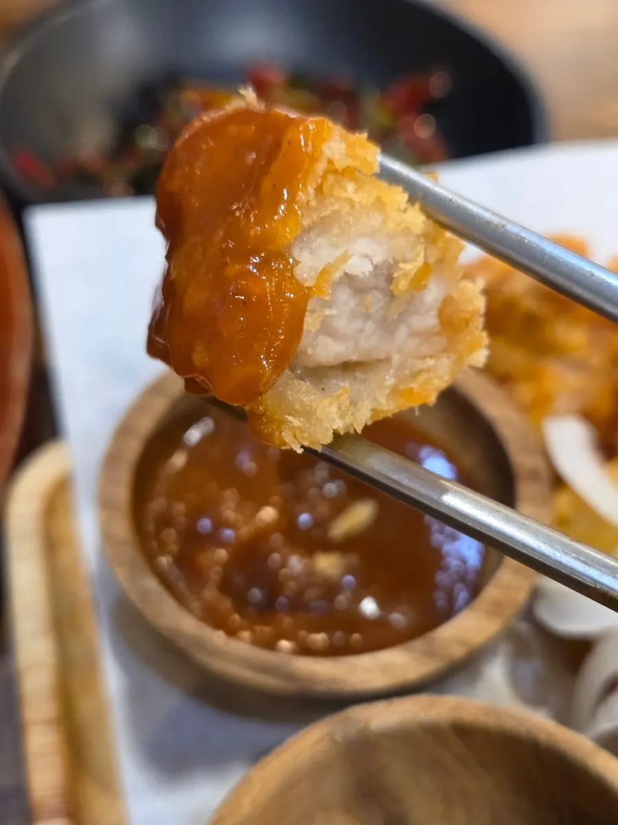 Dontang and chitang topped with sauce