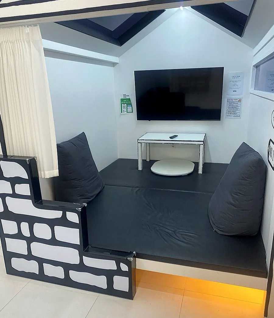 A comic café room with a TV