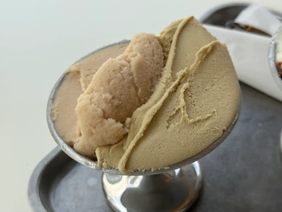 Two-flavor gelato served in a chilled bowl
