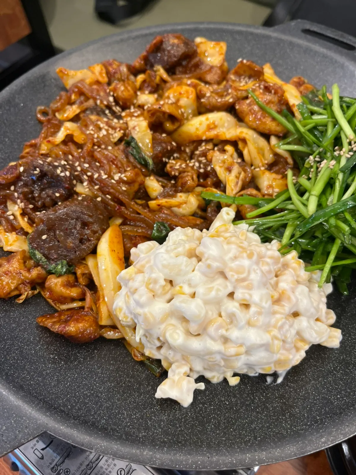 Vegetable gopchang and sundae-gopchang, one serving each, on the griddle