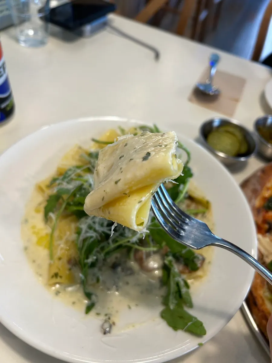 Half-and-half pizza and truffle mushroom spaghettini short pasta