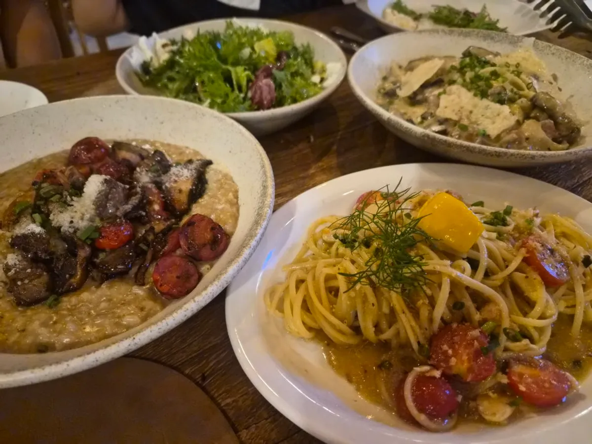 Pasta and risotto laid out together for the family dinner