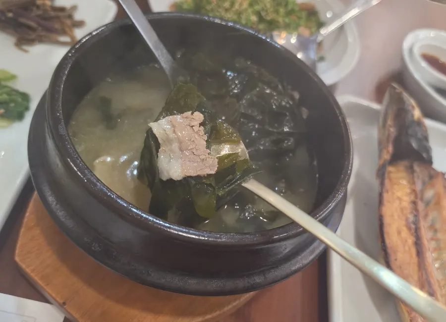 Table spread with cockle bibimbap and seaweed soup together