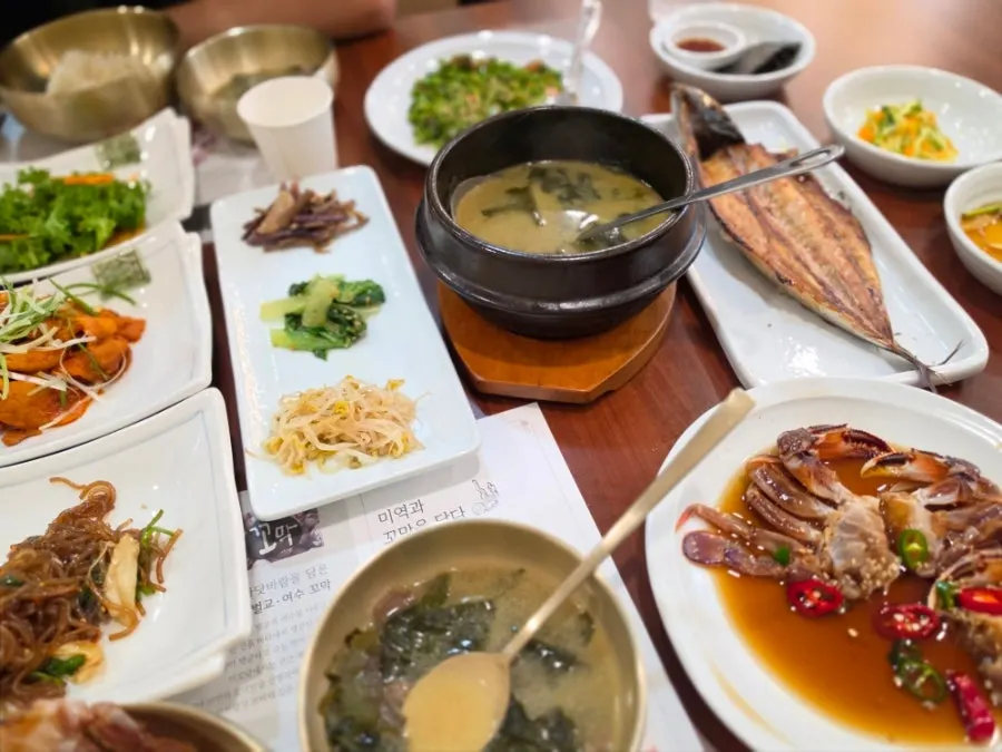 A warm Korean meal spread across the Mikodam table