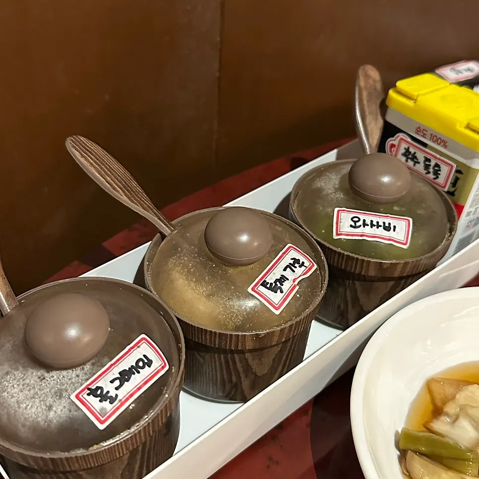 Table setting with side dishes at Miso Gopchang Wolseong