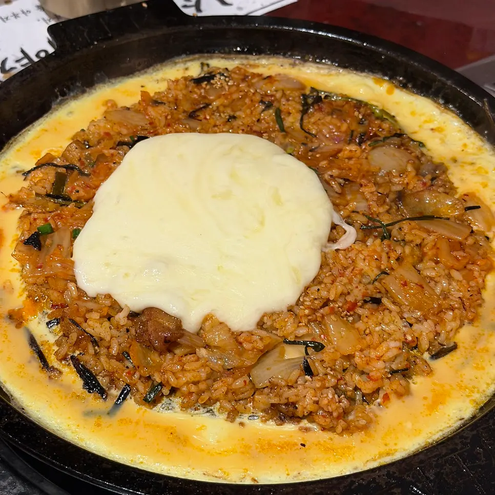 Kimchi fried rice pressed flat on the grill