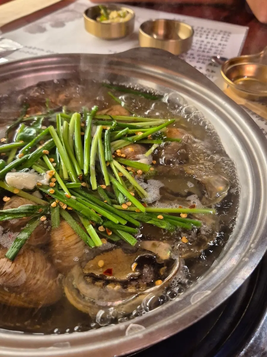 Close-up of clam soup with abalone
