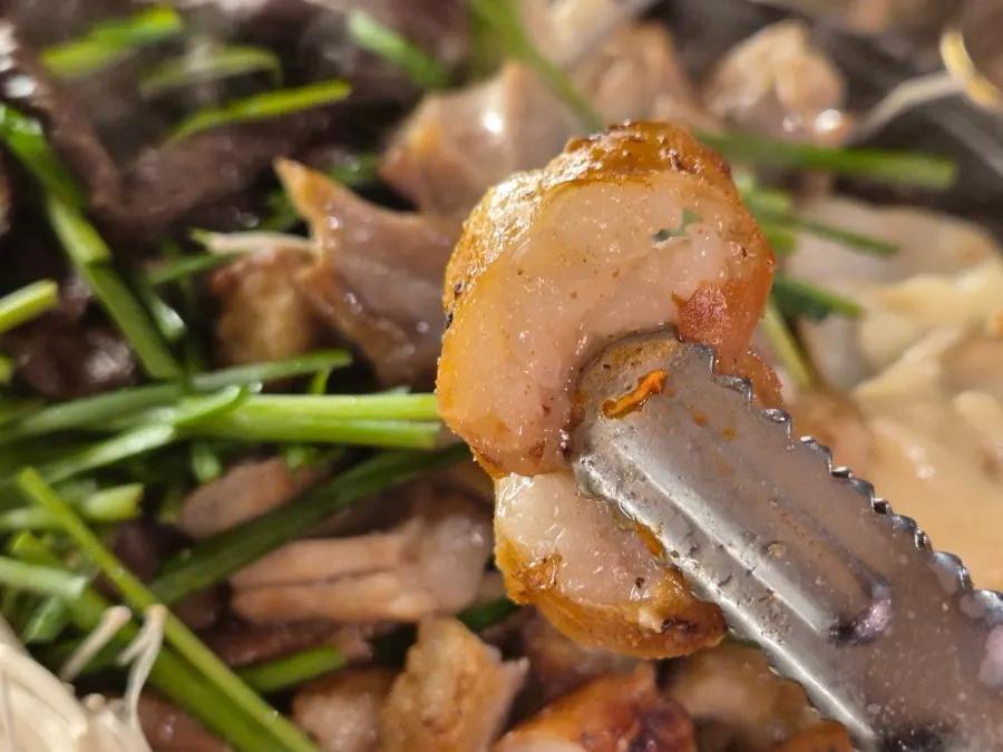 A piece of meat paired with Miso's special meat sauce