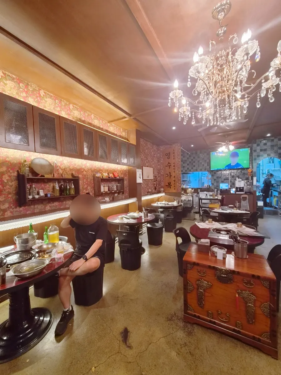 View of the storefront of Miso Gopchang Wolseong in the late evening