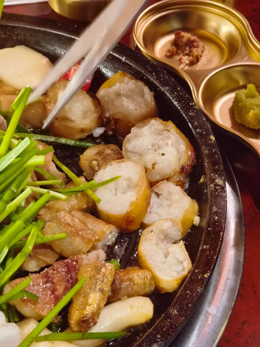 Grilled gopchang enjoyed with a cold beer
