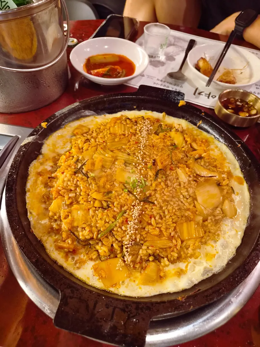 Perilla oil kimchi fried rice served on a hot stone plate