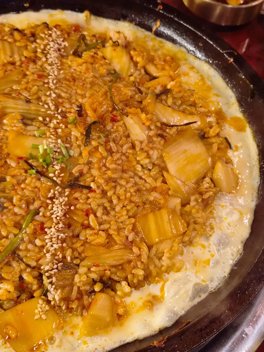 Crispy fried rice crust pressed onto the stone plate