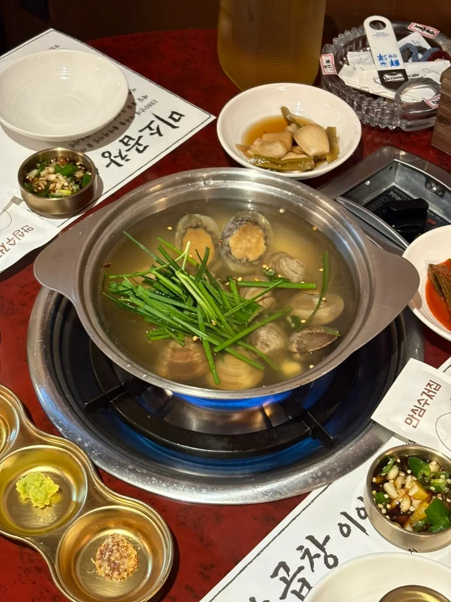 Complimentary abalone clam soup and side dish setup