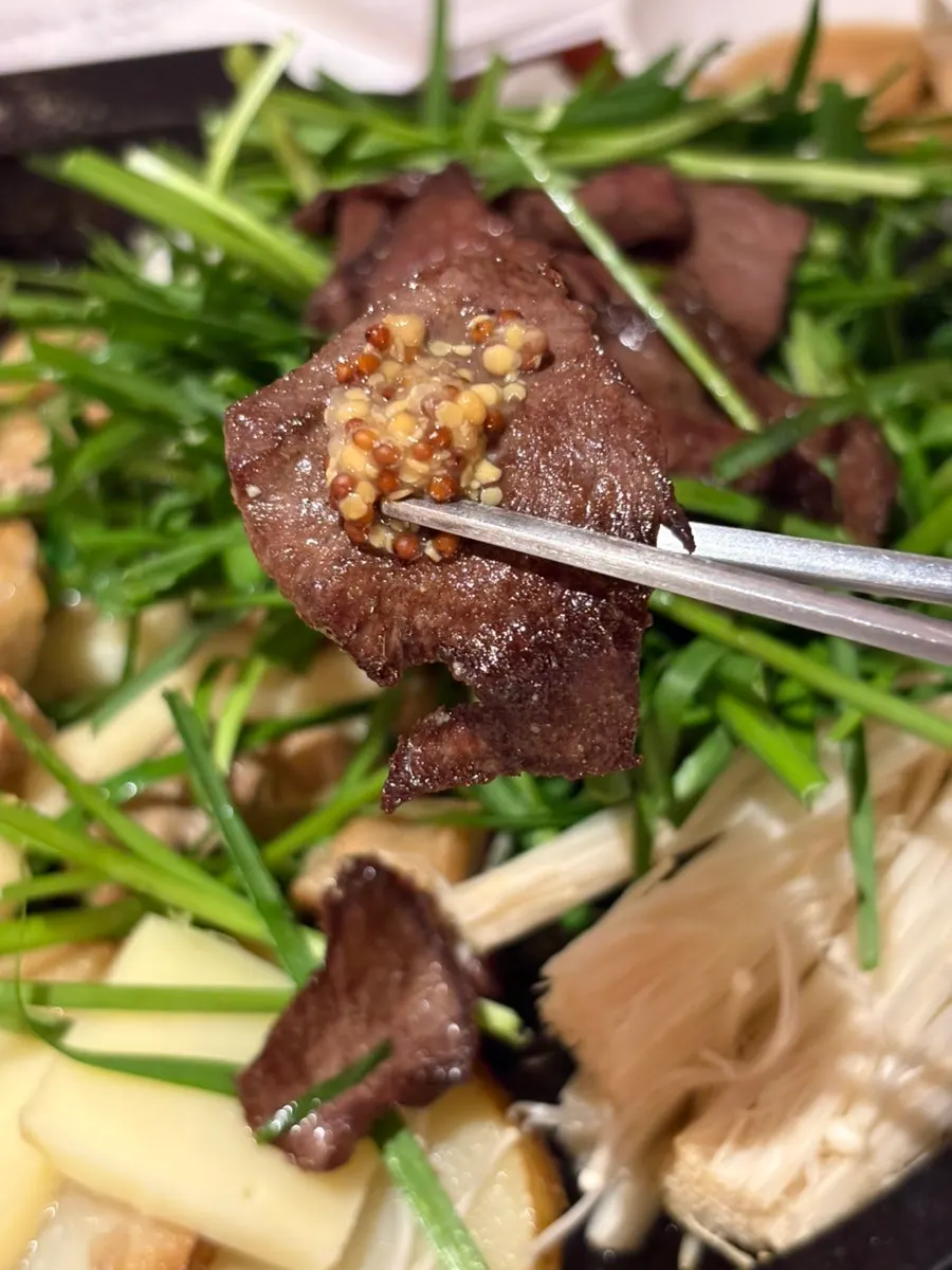Korean beef heart cooking on the grill