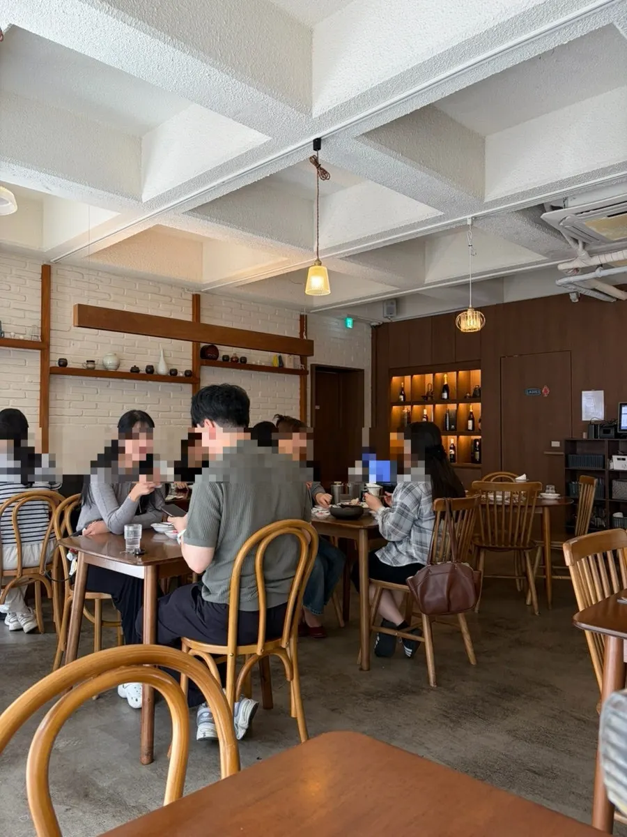 Modern interior with warm lighting and table seating
