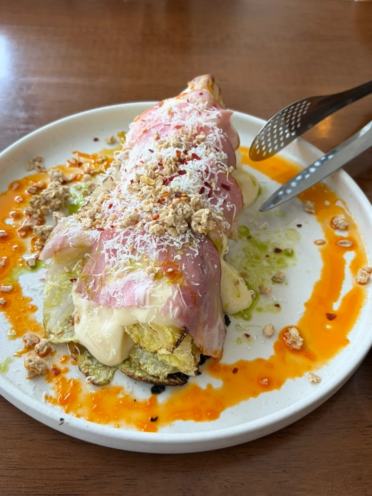 A bite of salad combining jambon and napa cabbage