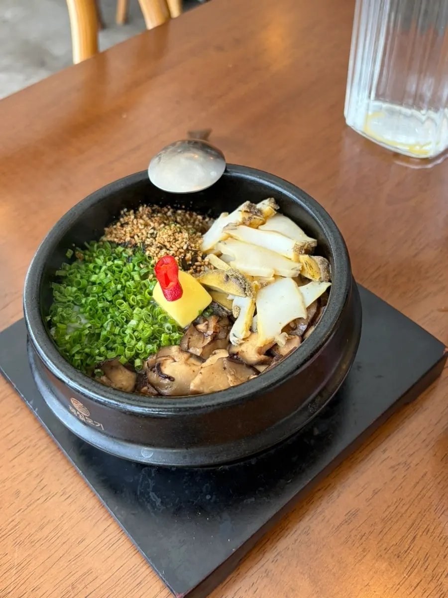 Lid removed from abalone mushroom butter pot rice