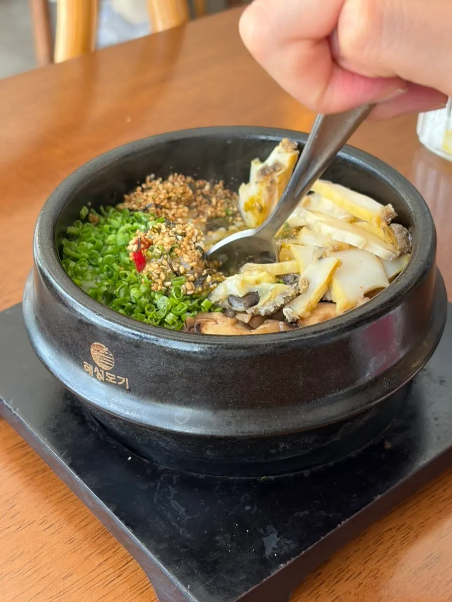 Abalone and mushrooms mixed evenly through butter pot rice