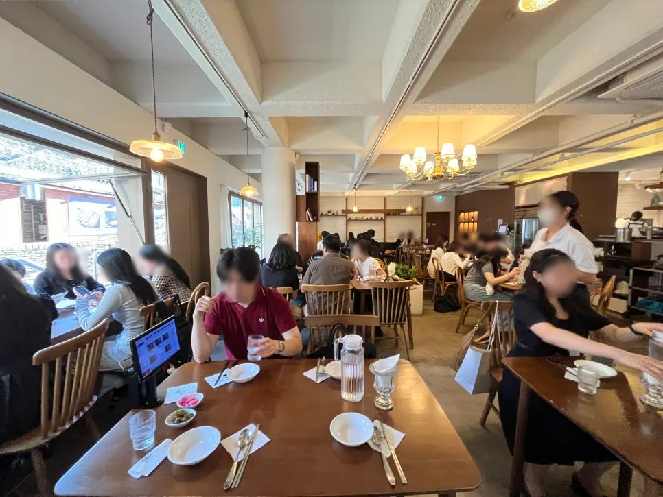 View of the tables and seating inside Moa Gangnam