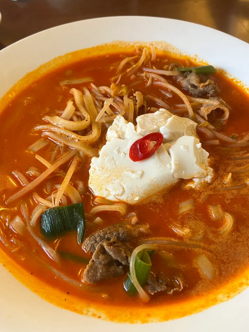 A bowl of beef brisket sundubu kalguksu