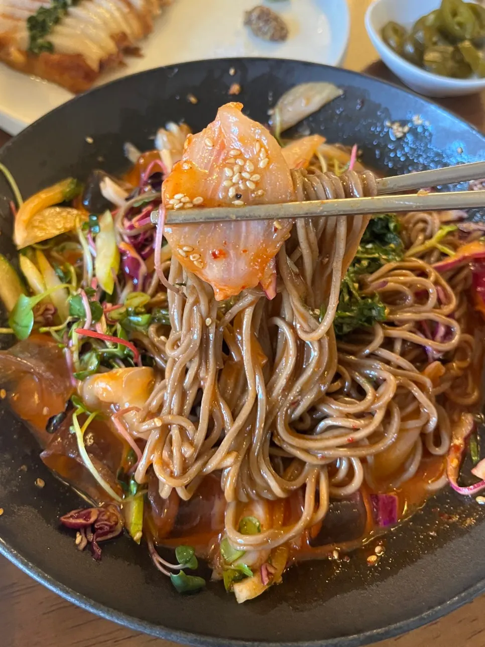 Flounder, crunchy vegetables, and buckwheat noodles gathered together
