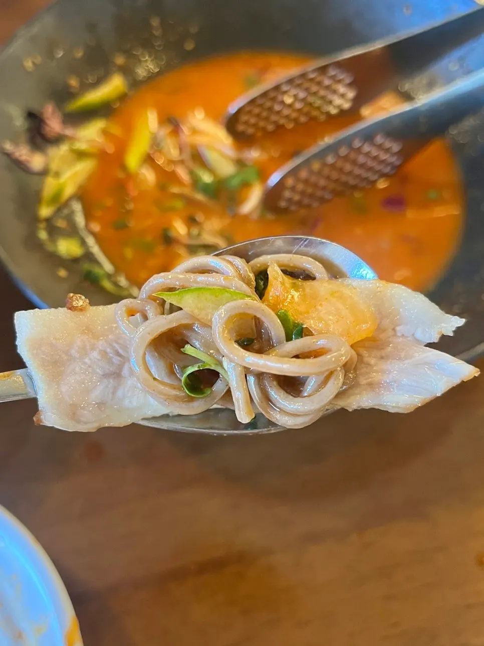 Pork jowl topped with spicy buckwheat flounder noodles