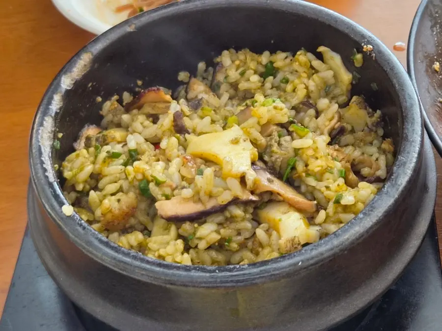 Hot pot rice portioned into bowls to share