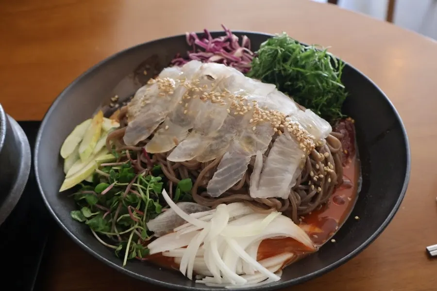 Spicy-tangy sauce, buckwheat noodles, and raw flounder