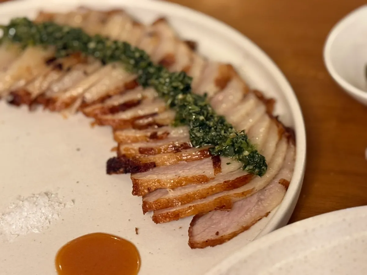 Fern-herb jimichuri pork jowl served with four dipping sauces