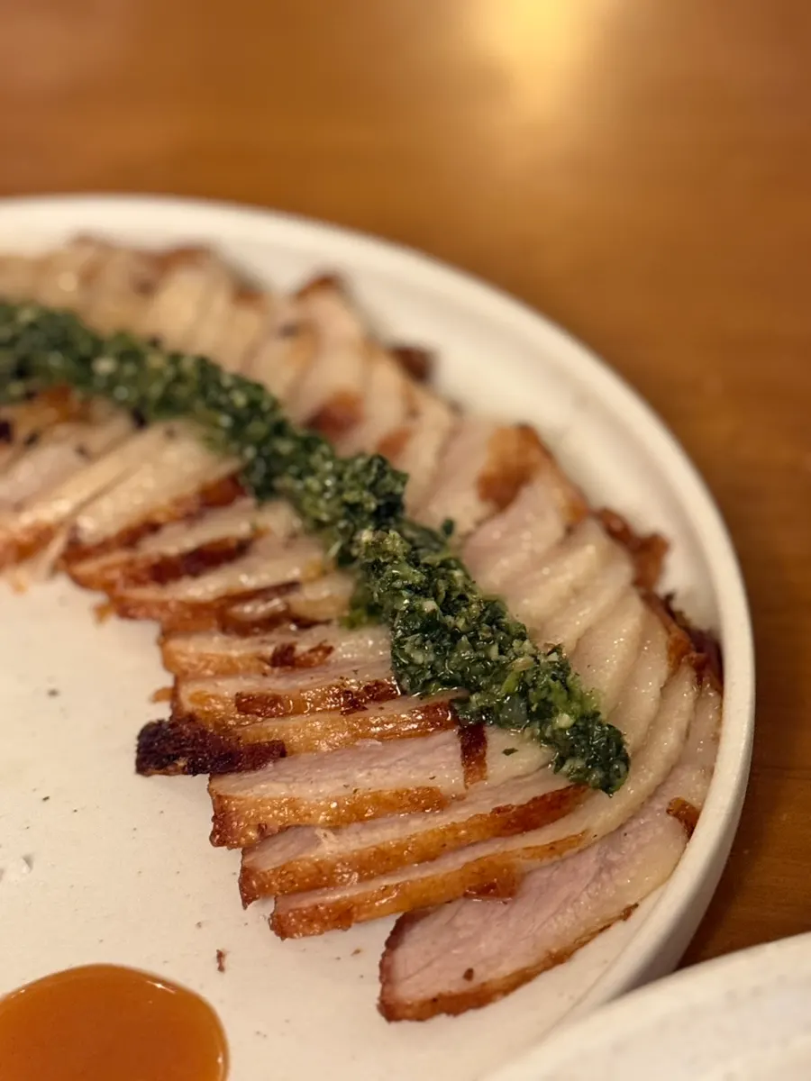 A plate of thinly grilled pork jowl