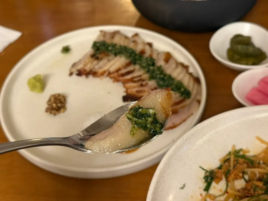 Cross-section of pork jowl with fern-herb jimichuri sauce