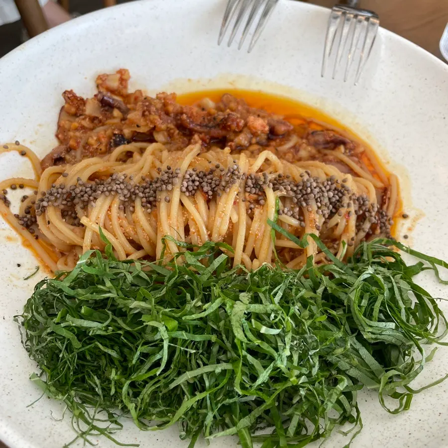 Perilla oil pasta with salted seafood topped with whole perilla seeds