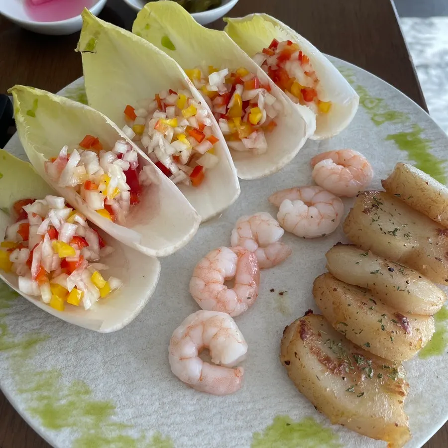 Plated grilled scallop and endive lettuce wraps at Moa Gangnam