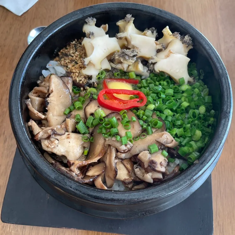 Abalone and mushroom inside the pot rice before mixing