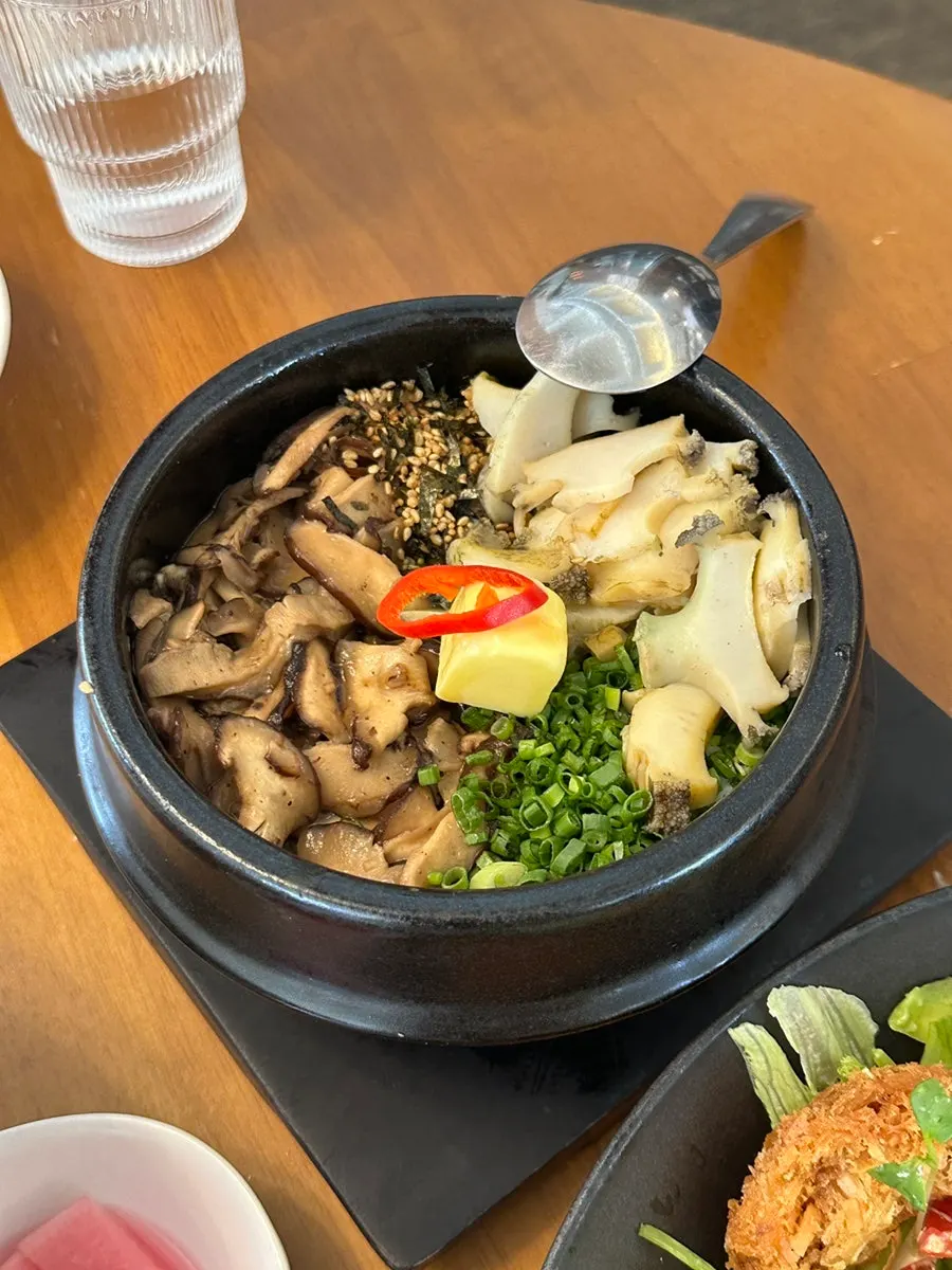 Abalone mushroom butter pot rice piled high with abalone