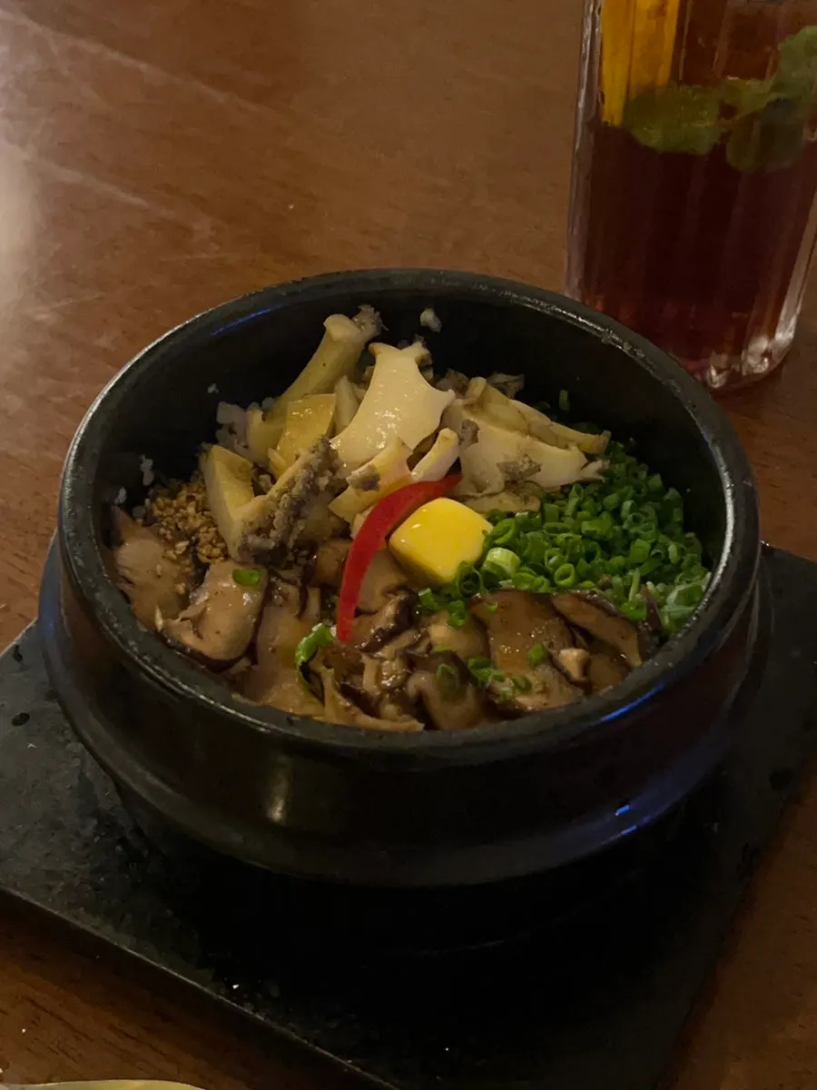 Abalone mushroom pot rice stirred with melted butter