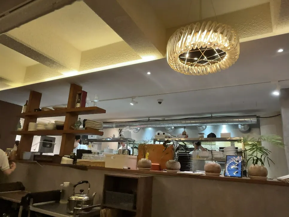 Interior of Moa Gangnam with wood-tone decor and soft lighting