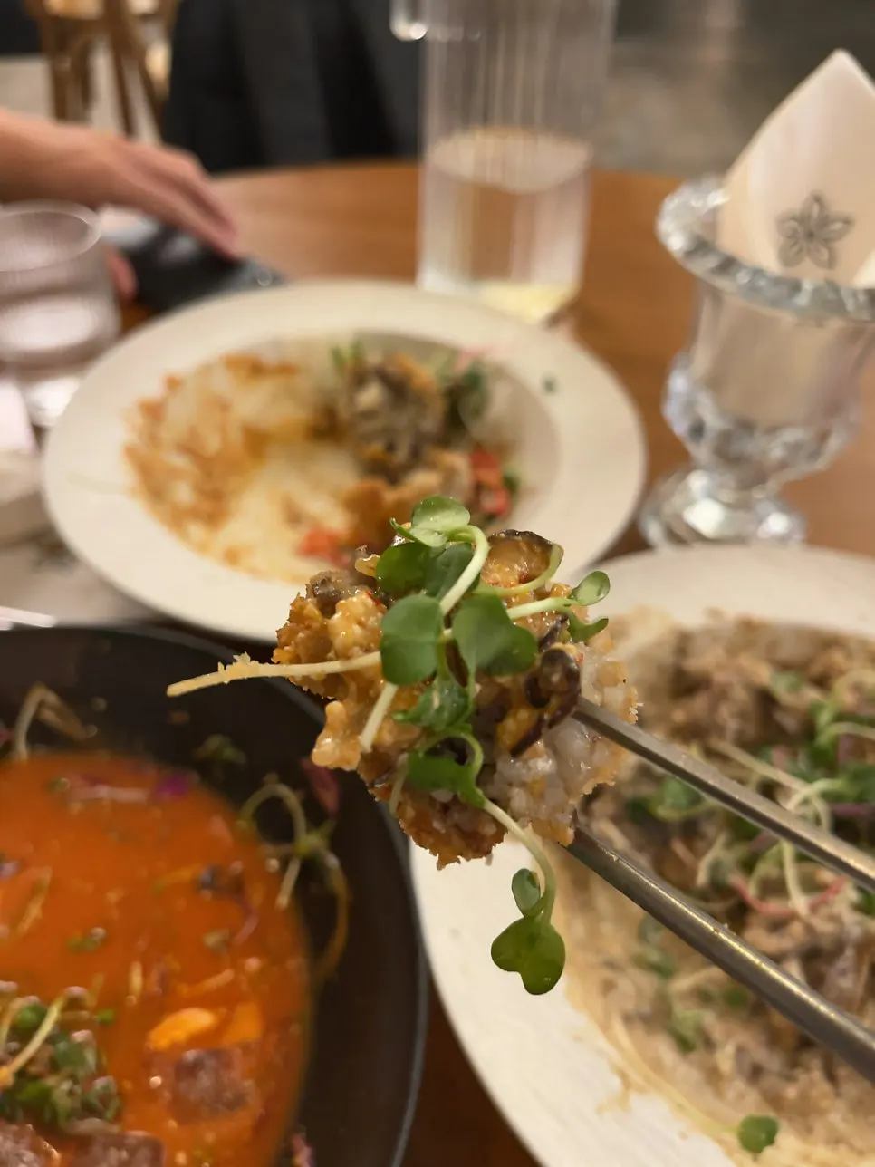 A bite-sized piece of the doenjang arancini picked up