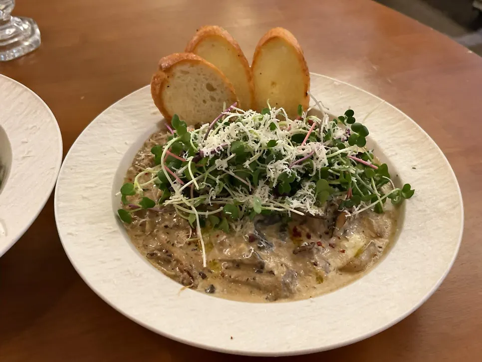 A plate of meatballs in fern cream sauce