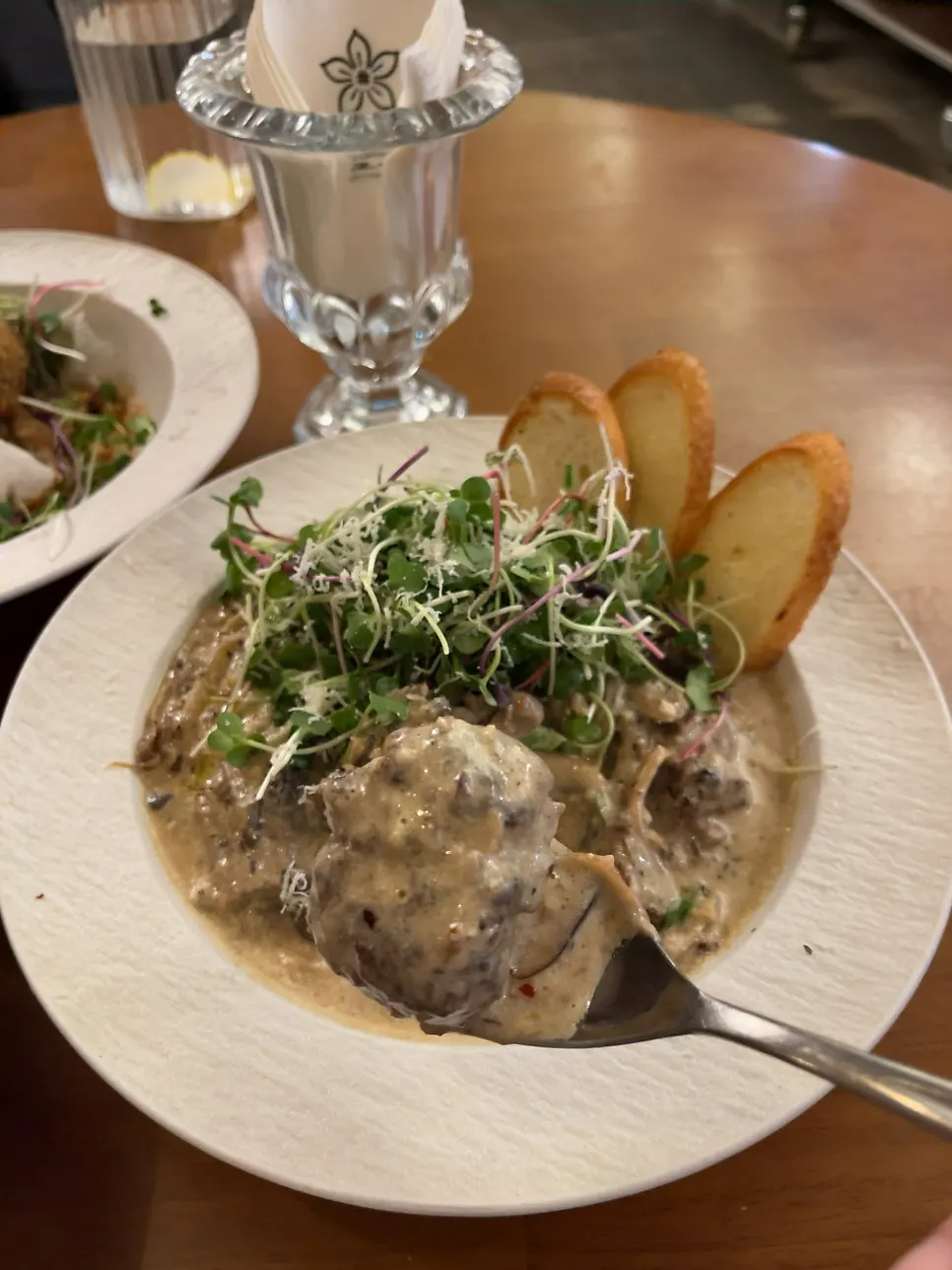 A spoonful of fern cream meatball showing the meat texture