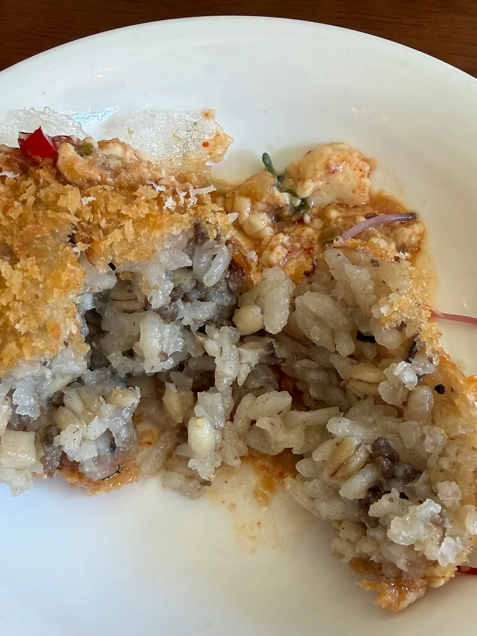 Arancini eaten with fried rice paper