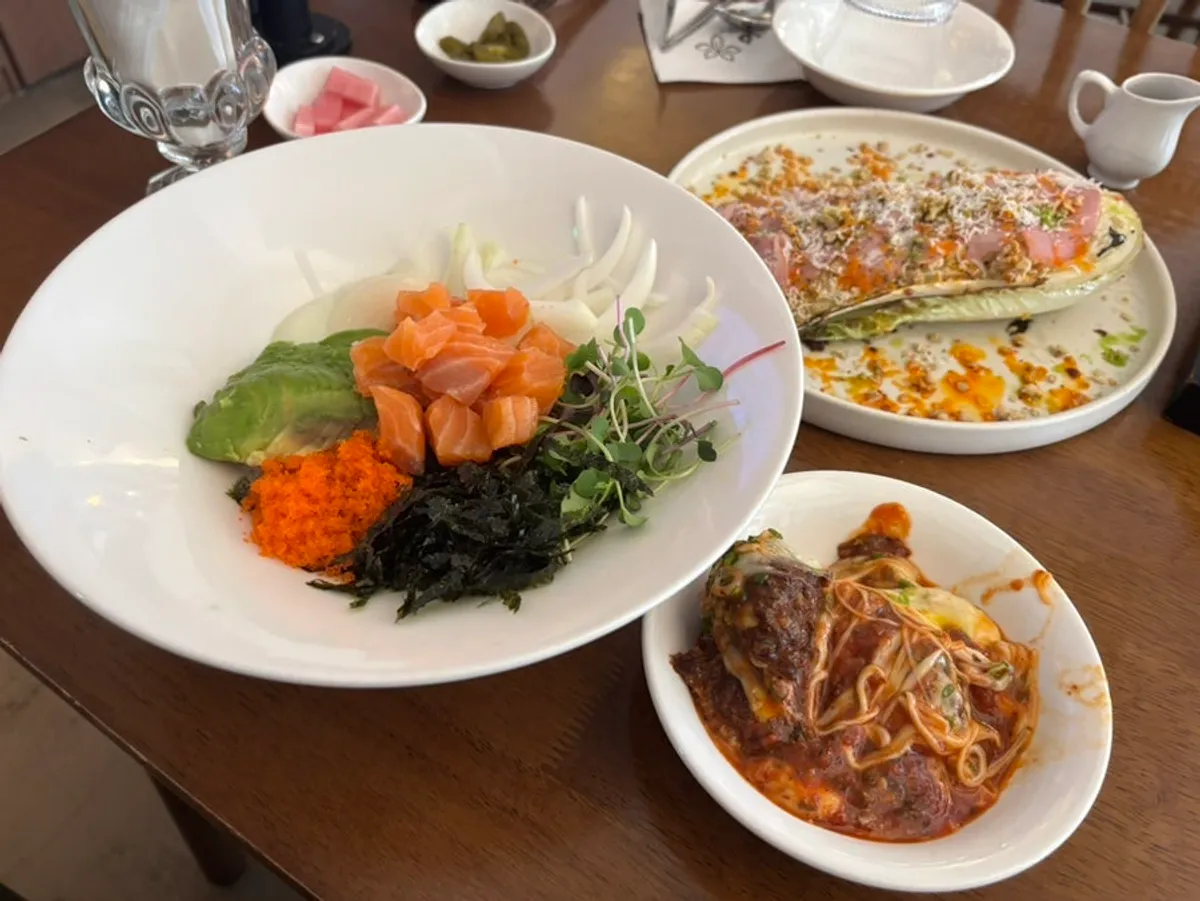 A plate of spicy tomato Korean beef cheese tteokgalbi