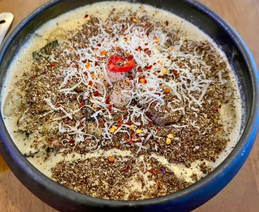Gondre cream sujebi topped with perilla powder and cheese