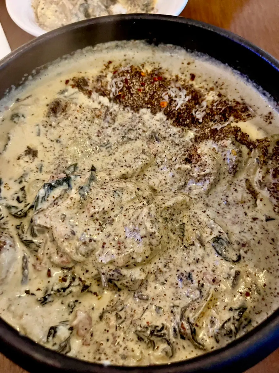 A bowl of gondre cream sujebi with shrimp