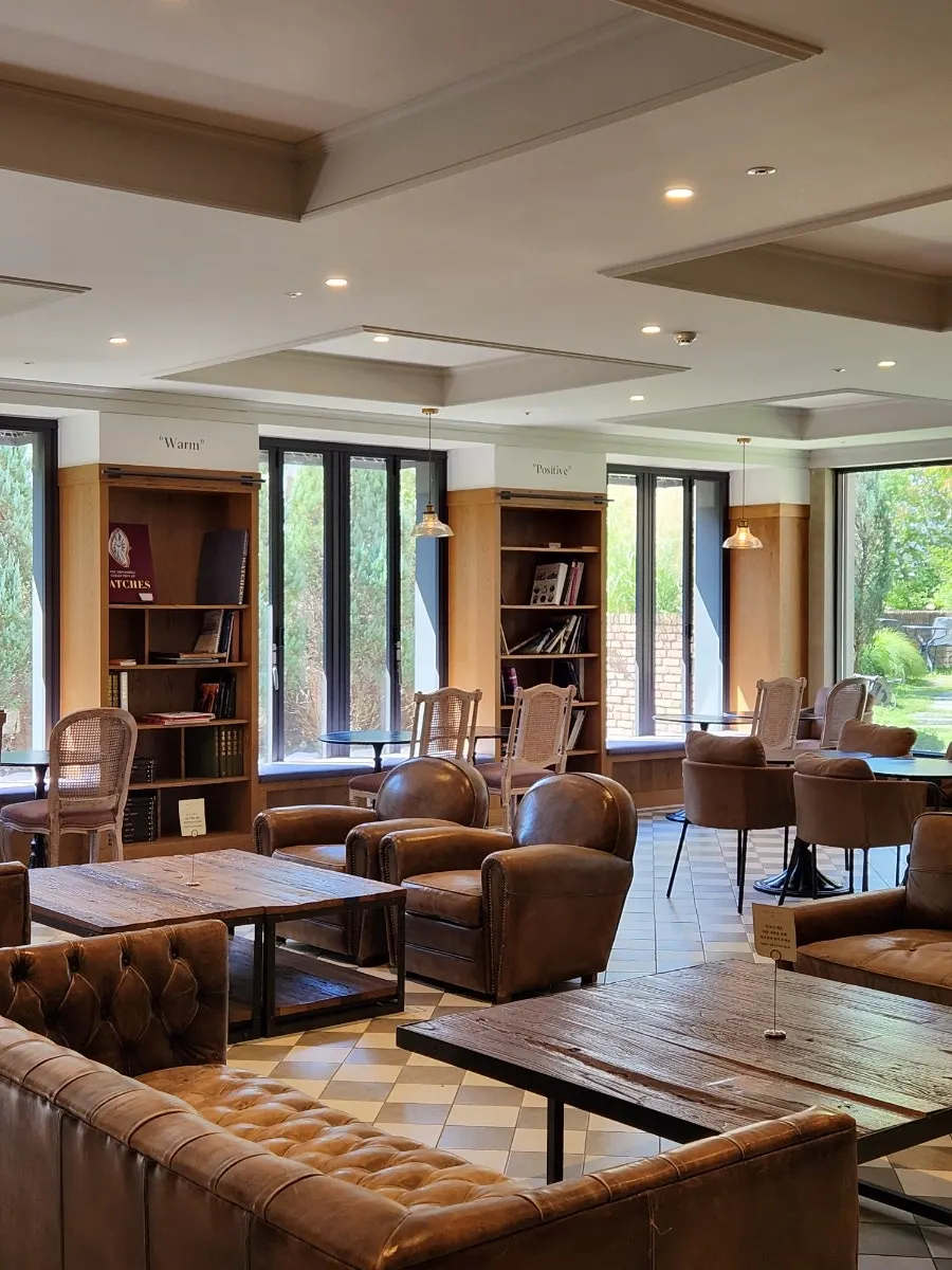 Library with Chesterfield leather sofas