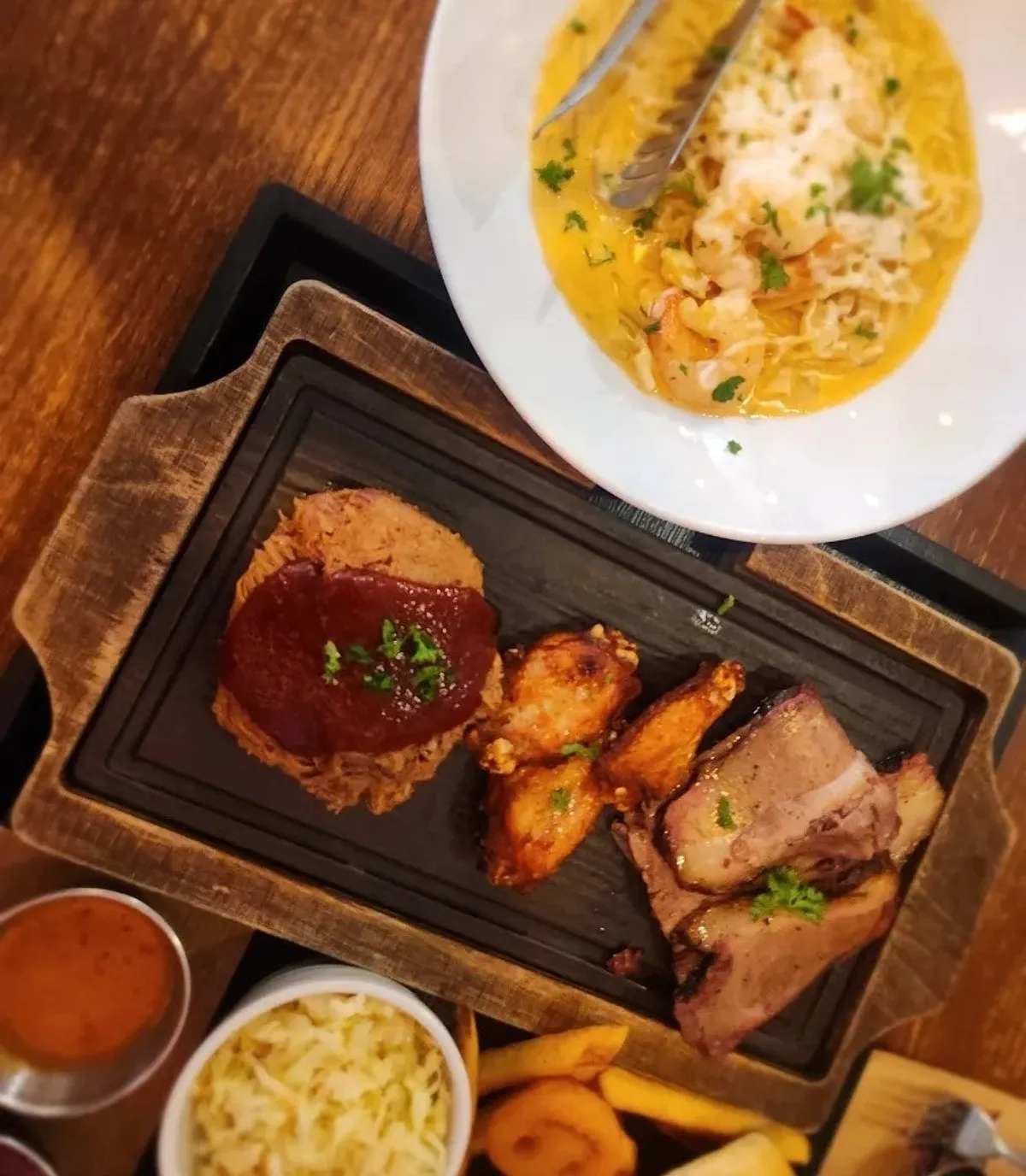 Texas platter with brisket, pulled pork, and buffalo wings