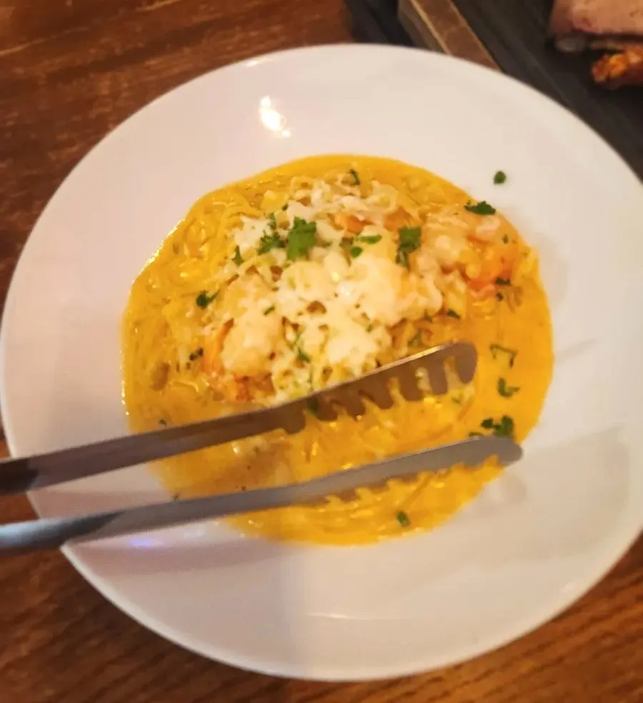 A plate of shrimp cream pasta