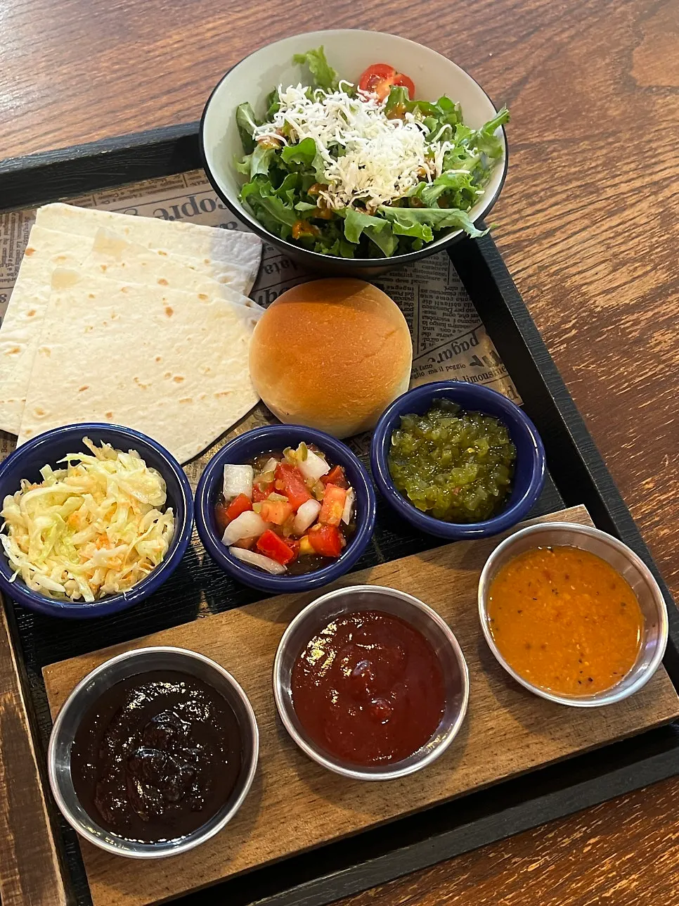 Set served with salad, tortillas, and dinner rolls
