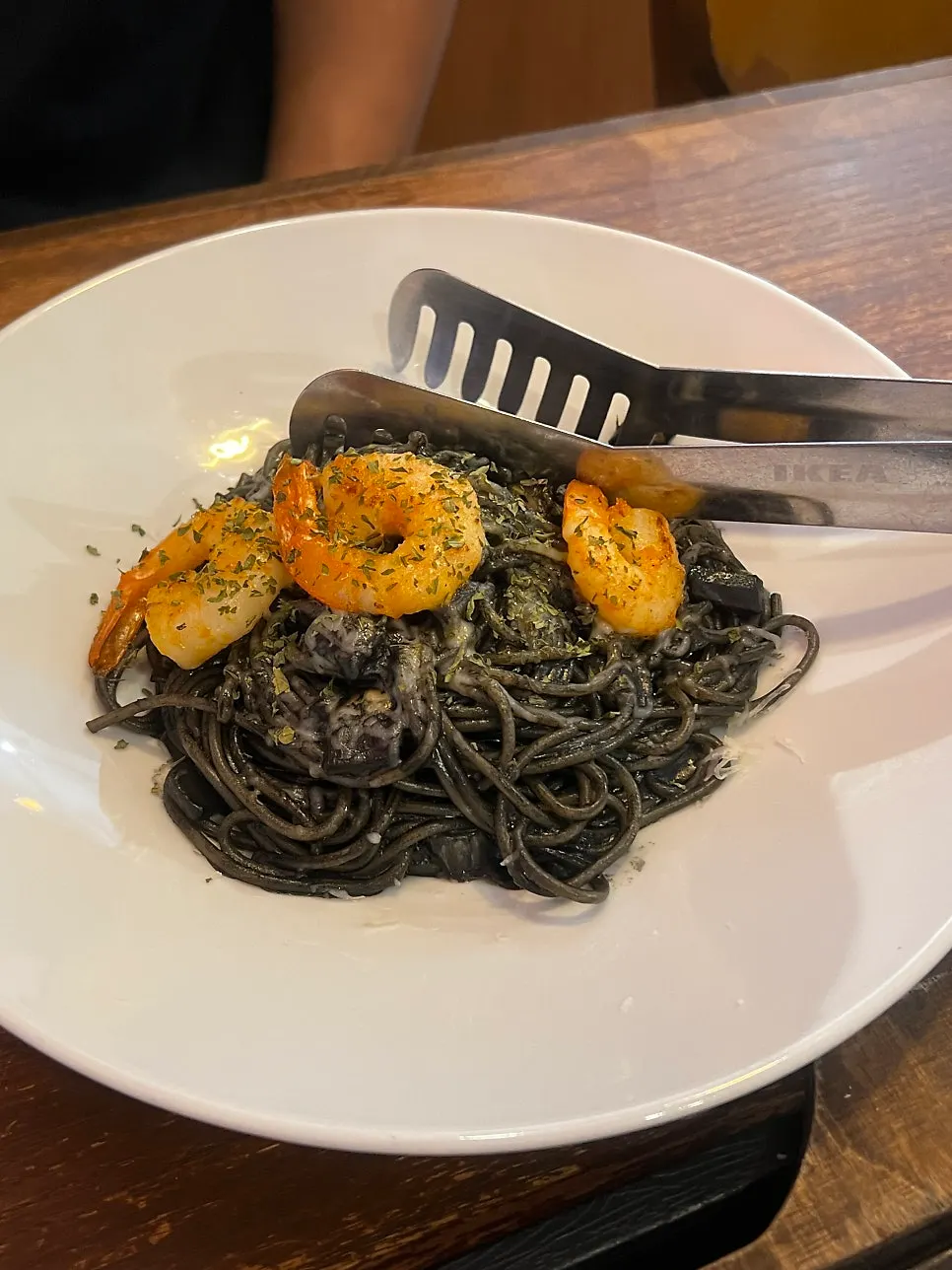 Steaming shrimp squid-ink cream pasta