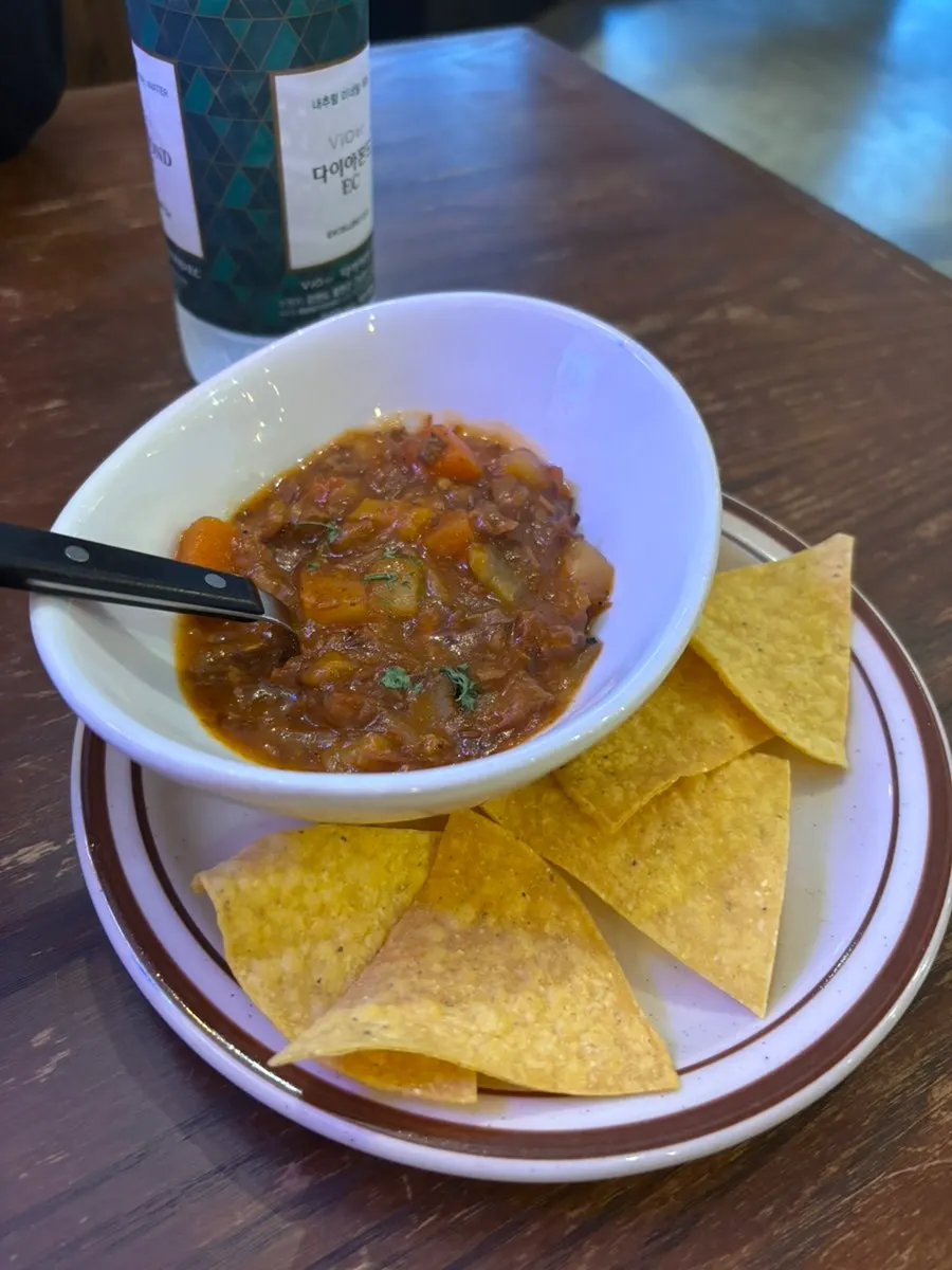 Nachos with house-made sauce served as appetizer